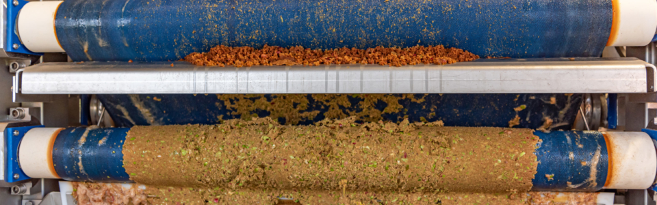 Modern Machine squeezes apples and apple pomace remain as press residues